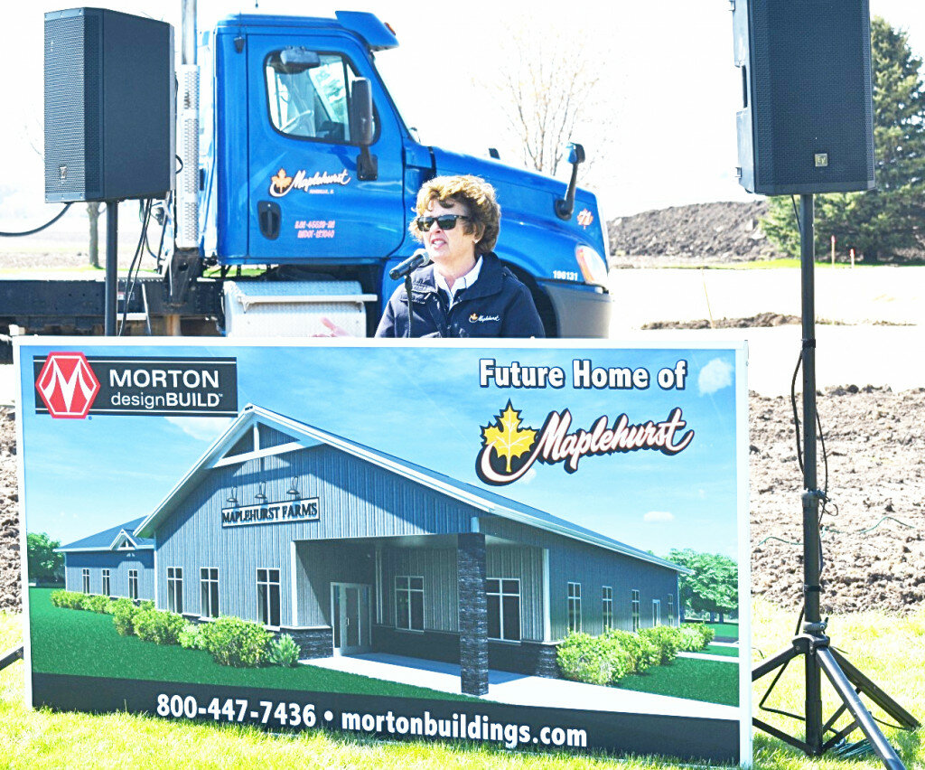 Lyn Carmichael, president of Maplehurst Farms, speaks during a groundbreaking ceremony for construction on a new corporate office in Rochelle. (Photo by Russell Hodges)