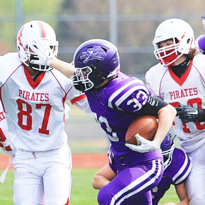 Sophomore Trey Taft stiff arms an Ottawa defender during the Rochelle Hub fresh-soph football game against the Pirates on Saturday. (Photo by Marcy DeLille)