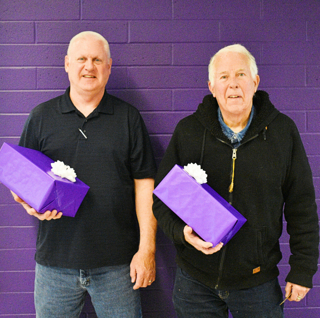 District 212 board members Brent Tracy (left) and Bob Walsh (right) were each recognized for their service during the April board meeting Monday night. Both members are retiring from the board. (Photo by Russell Hodges)