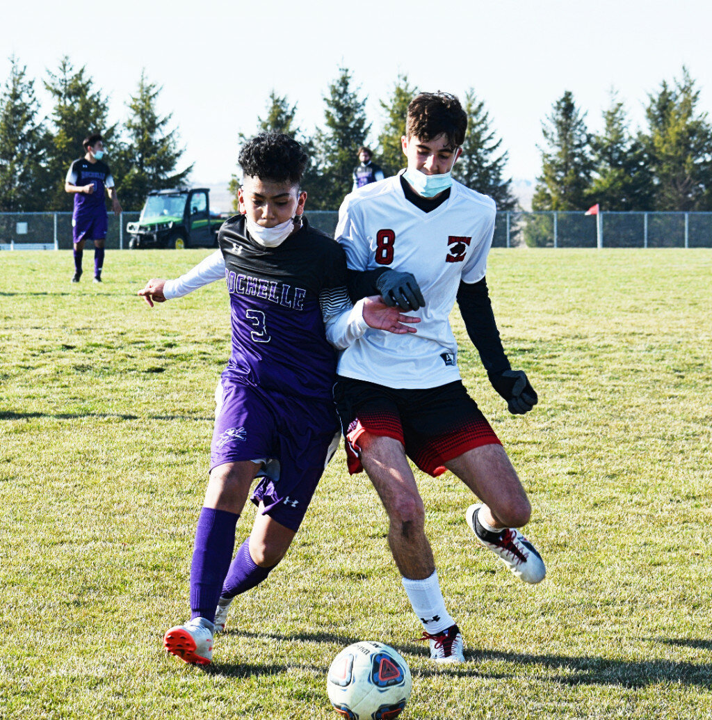 Freshman Diego Salazar fights for possession during the Rochelle Hub varsity soccer match against Indian Creek on Thursday. (Photo by Russell Hodges)