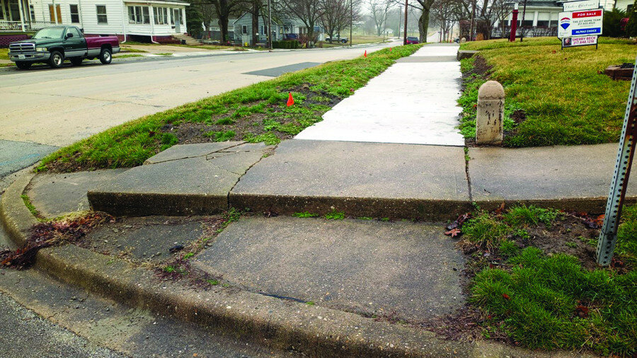Gordon Woods / Journal — 
The city will make this step ADA compliant, matching the sidewalk directly to the south at the intersection of N. Center and Webster streets.