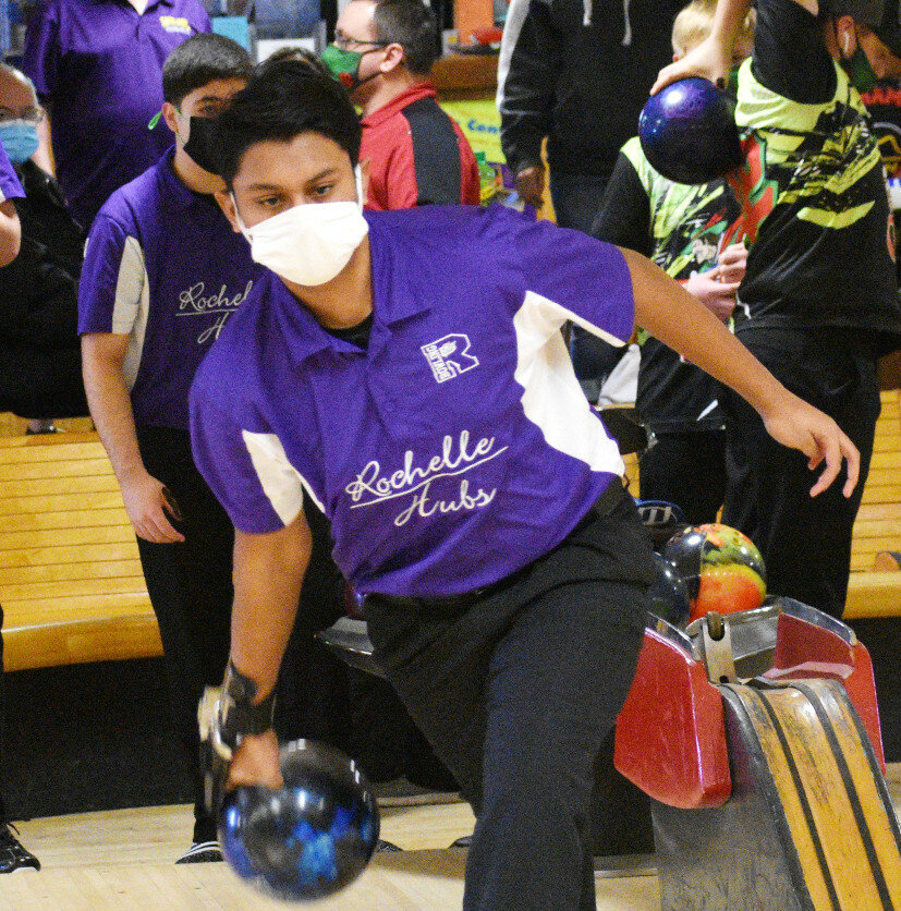 Junior Devansh Patel throws his strike ball during the Rochelle Hub varsity bowling match against LaSalle-Peru on Wednesday. (Photo by Russell Hodges)