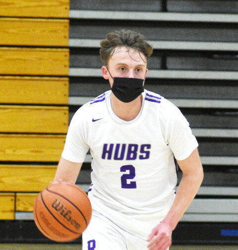Senior Garrett Burdin scored a season-high 30 points and made 12 field goals during the Rochelle Hub varsity basketball game against Sycamore on Friday. (Photo by Russell Hodges)