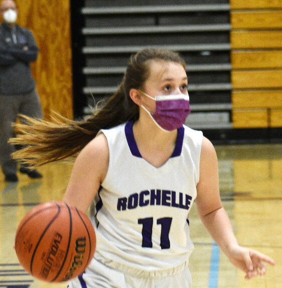 Freshman Loretta Atkinson drives the ball during the Rochelle Lady Hub fresh-soph basketball game against Sycamore on Tuesday. (Photo by Russell Hodges)