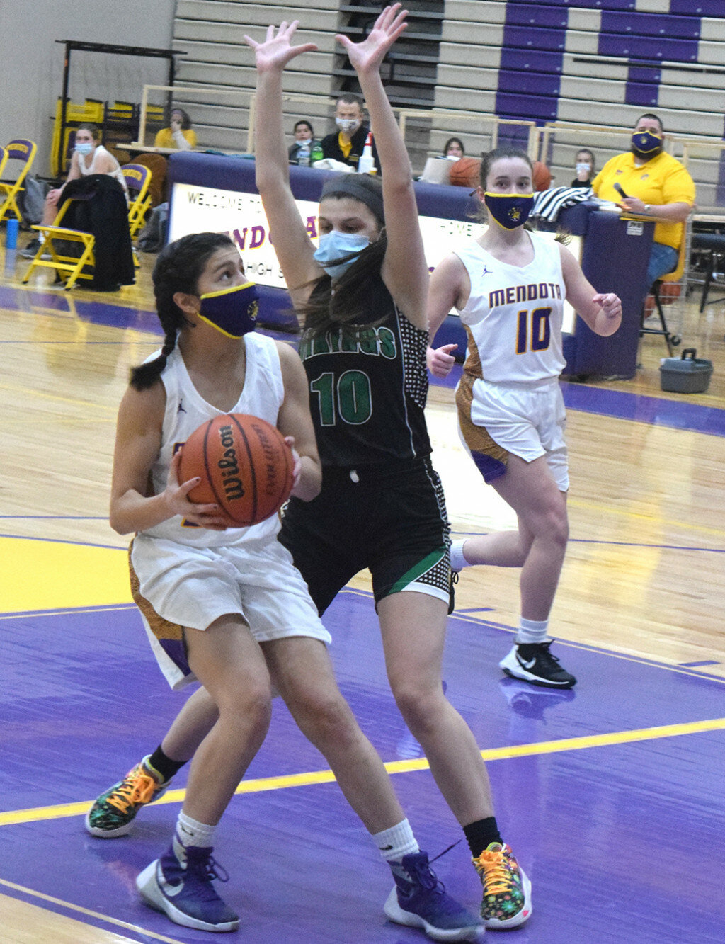 Mendota’s Daisy Arteaga drives into the lane and looks for room to shoot over the defense of North Boone’s Makenzie Yarc on Feb. 6 at the MHS gym. (Reporter photo)