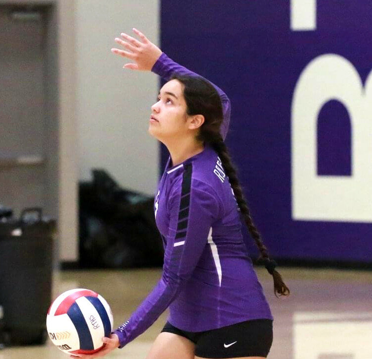 Senior Jesenia Solano prepares to serve for the Lady Hubs. Solano took on a reserve role with the varsity volleyball team this past season, but she’s looking to expand her role this spring. (Photo by Marcy DeLille)