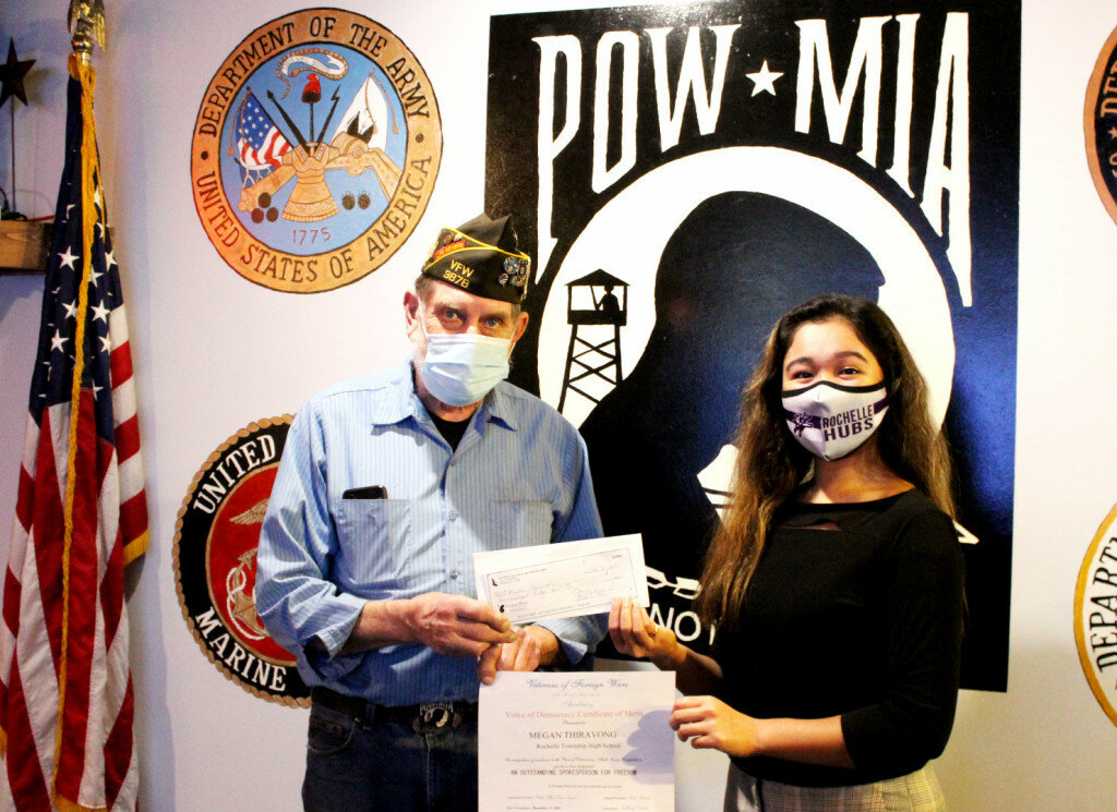 Megan Thiravong was presented with a certificate and two checks from Rochelle VFW Post 3878 Commander Bill Bumgarner for her fourth place finish in the VFW District 6 essay contest.