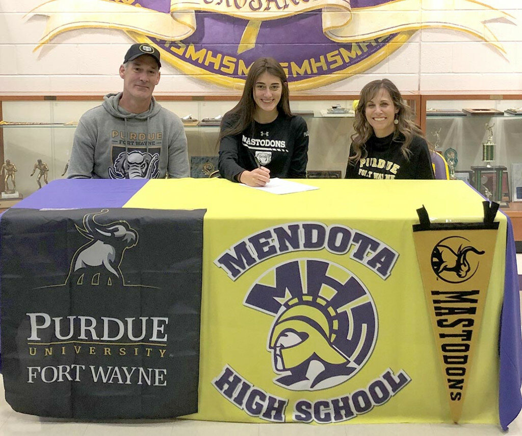 Mendota High School senior Amellia Bromenschenkel will continue her basketball career at Purdue University-Fort Wayne. At her signing ceremony on Nov. 11, front row, left to right, are Chad Bromenschenkel, Amellia Bromenschenkel and Debi Bromenschenkel. Some of her former coaches during her career also attended. They included Brian Blumhorst (MHS), Gary Barrera (MHS), John Hansen (MHS), Dave Knottnerus (Northbrook Middle School) and Pat Cinotte (IV Warriors AAU). Tom Hohenadel, Illinois Elite AAU, was absent.