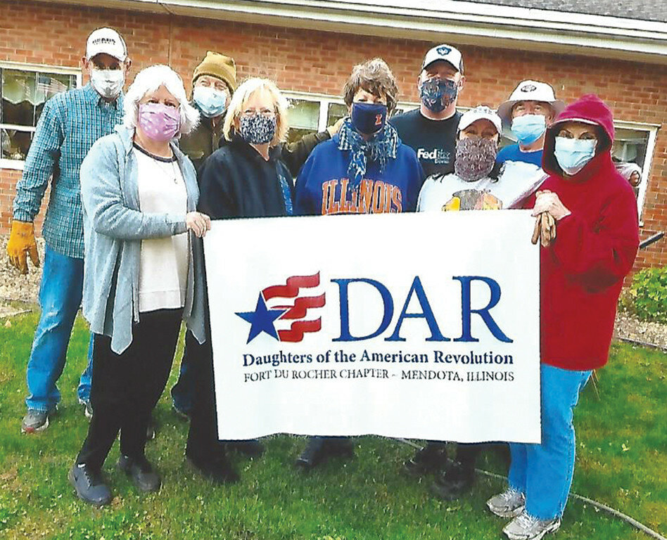 The Fort du Rocher chapter of National Daughters of the American Revolution spent a Day of Service beautifying the grounds at the LaSalle Veterans Home. Participating in the event, front row left to right, are Janet Koch, Joni Bratney, Leslie Althaus, Kathleen Bonnell and Linda Sigmon Byrd; back row, Kent Shelor, Bill Bratney, Matt De Graeve and Emerson Byrd. (Photo contributed)