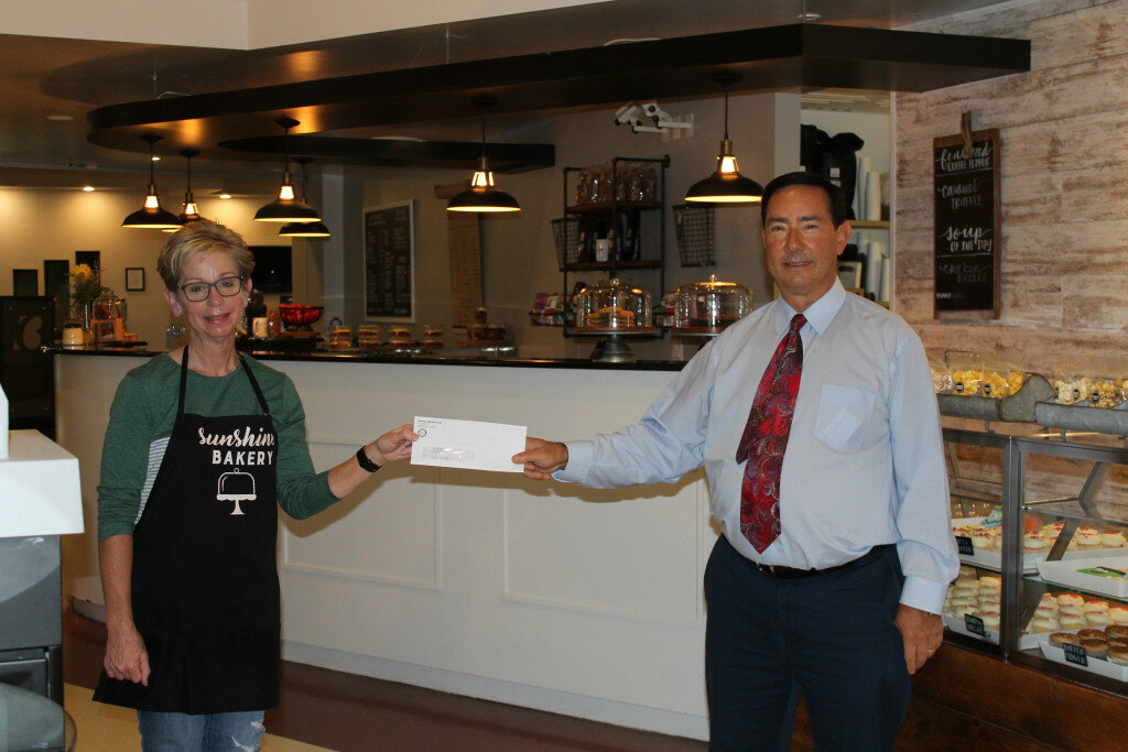 Barb Becker, on behalf of Sunshine Bakery, accepted the $1,000 check that the bakery won from the daily Cash Calendar drawing on Labor Day from Rochelle Rotarian Dave Eckhardt. The Rochelle Rotary Club is currently selling the Cash Calendars for 2021. Each person who purchases a calendar is entered to win a cash prize daily - 365 chances ranging from $25 to $1,000 - and help support eight local non-profit groups through the club’s From the Heart committee.