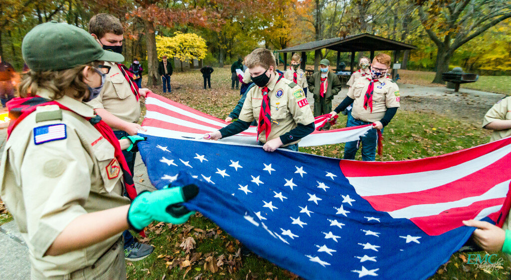 Courtesy of Edvydas Cicenas — Local Boy Scouts recently held a ceremony to retire old flags.  Scout Jacob Hewerdine carefully cuts out the field of stars as other BSA Scouts help hold the flag during the ceremony.  See the story and more photos on page A9 of the 10/23 Journal print edition or E-Edition.