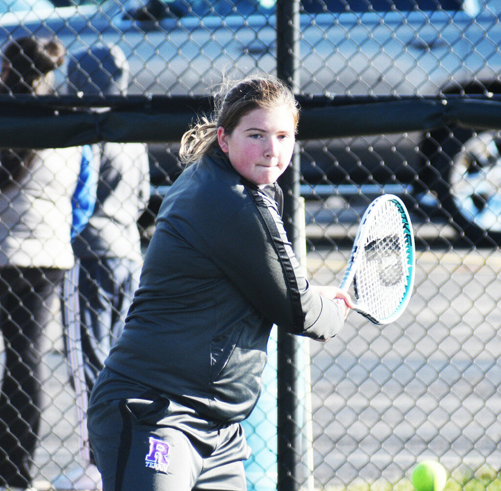 Senior Sawyer McGee hits a backhand shot for the Lady Hubs. McGee and teammate Sylvia Hasz placed third in the doubles bracket of the IHSA 1A Rochelle Sectional this past weekend. (Photo by Russell Hodges)