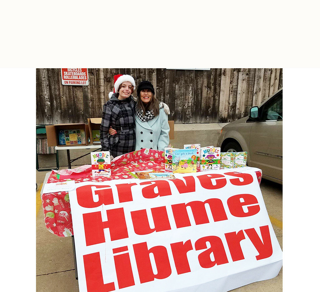 Books are given to children at a recent Christmastime event in Mendota. (Photo contributed)