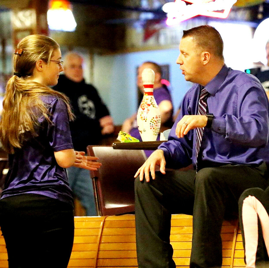 Rochelle head coach Joey Johanning (right) works with Lady Hub bowler Carly Summers during a home match this past season. Johanning has resigned in order to accept a head coaching position at Sycamore. (Photo by Marcy DeLille)