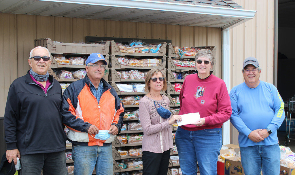 Pictured left to right are White Rock Township Supervisor Thomas Smith, township trustee Jim Milligan, township trustee Lorraine Hubbard, Rochelle Christian Food Pantry board member Carol Hayenga and pantry board member Matt King. The township made a donation to the food pantry Friday mroning.