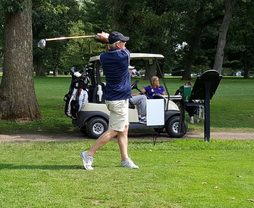 Wayne Cherry hits his drive off of hole No. 13. Cherry played with the SBM Business Solutions team and tied with Hub-Remsen Print Group for first place.