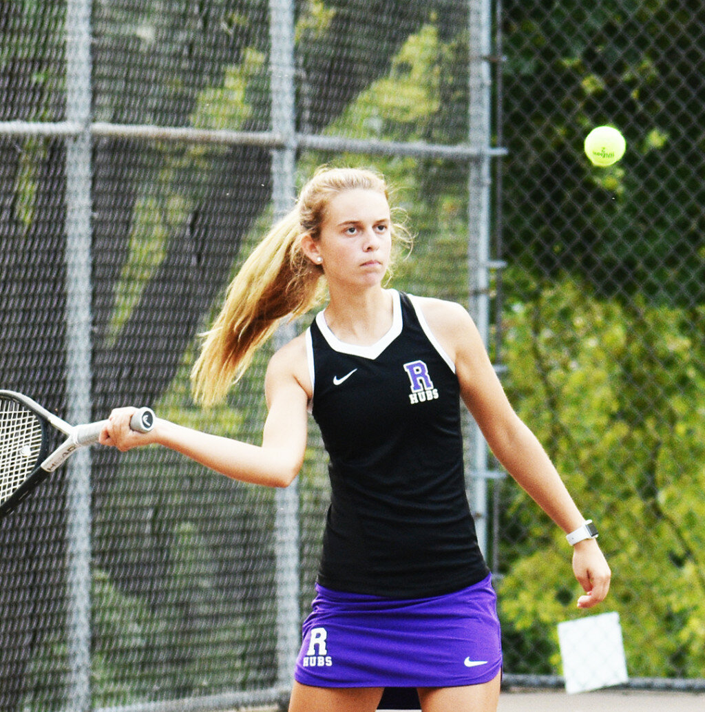 Junior MeLisa Young hits a forehand shot during Rochelle's varsity tennis match against Dixon on Monday. (Photo by Russell Hodges)