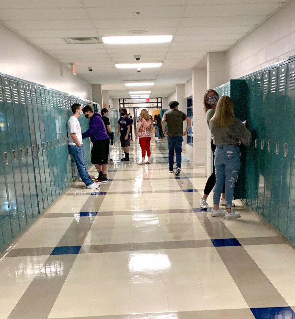 Mendota High School students gather at their lockers in preparation to head off to their first class during the opening day of school on Sept. 8.