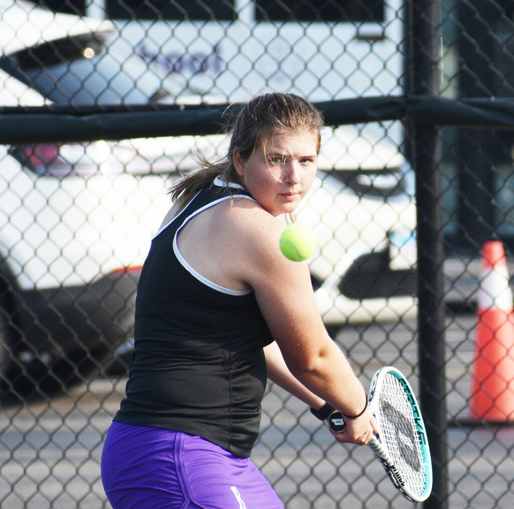 Senior Sawyer McGee goes to her backhand during Rochelle’s varsity tennis match against the Ottawa Pirates on Thursday. (Photo by Russell Hodges)
