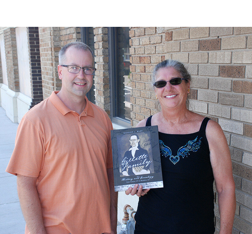 Cousins Richard Warp and Pamela Gillette share his new book about the Gillette family history and genealogy. (Reporter photo)