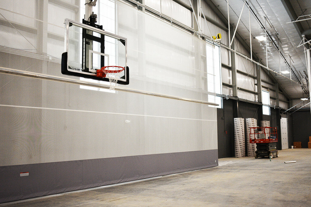 Workers have made significant progress on the Flagg-Rochelle Community Park District's recreation center over the last two months. Inside the fieldhouse, windows, basketball hoops and a walking track curtain have recently been installed. (Photos by Russell Hodges)