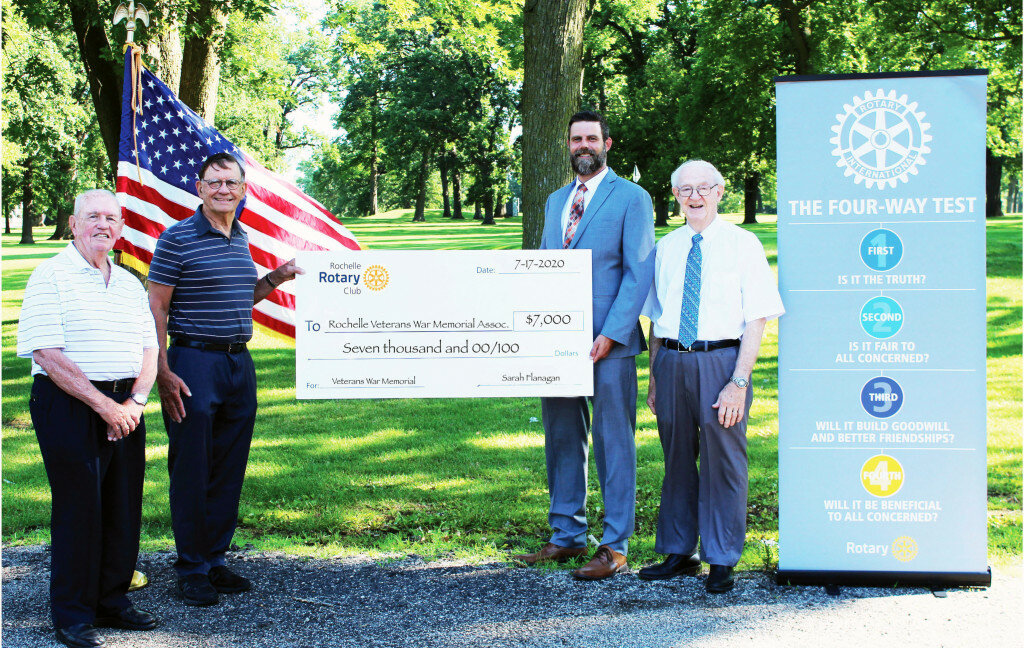 Representatives from the Rochelle Veterans War Memorial Association, Wendell ‘Pal’ Colwill (far left) and Chuck Roberts (second from left) and Rochelle Rotary Club, president Greg Folmar (second from right) and Sam Graber (far right) were on hand Friday morning for the presentation of a $7,000 donation from the Rochelle Rotary Club to the memorial association. The donation, part of the club’s NFL Pool, will be used toward the association’s bronze statue that is being placed at the Veteran’s War Memorial at Lawnridge Cemetery.