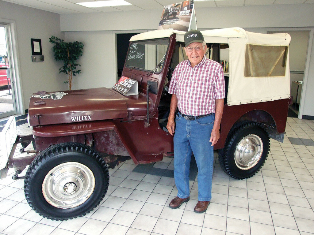 Gordon Woods / Journal — 
Bob Thomas with his 1948 Jeep.  It recently received some repairs at Wilson Chrysler-Jeep, Clinton.