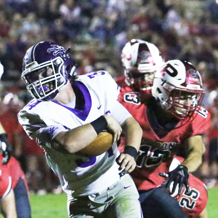 Rochelle senior Gavin Ansteth breaks a tackle for one of his career-high five touchdown runs during a victory over the Pekin Dragons this past fall. Ansteth was the 2019 Most Valuable Player on the football team. (Photo by Marcy DeLille)