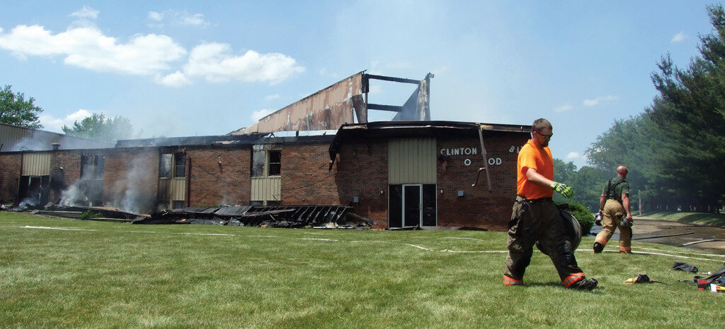 Gordon Woods / Journal — 
Firefighters begin removing equipment after fighting a fire that destroys the Assembly of God sanctuary.  Other portions of the building sustained only smoke damage.  Additional photos on page A7.
