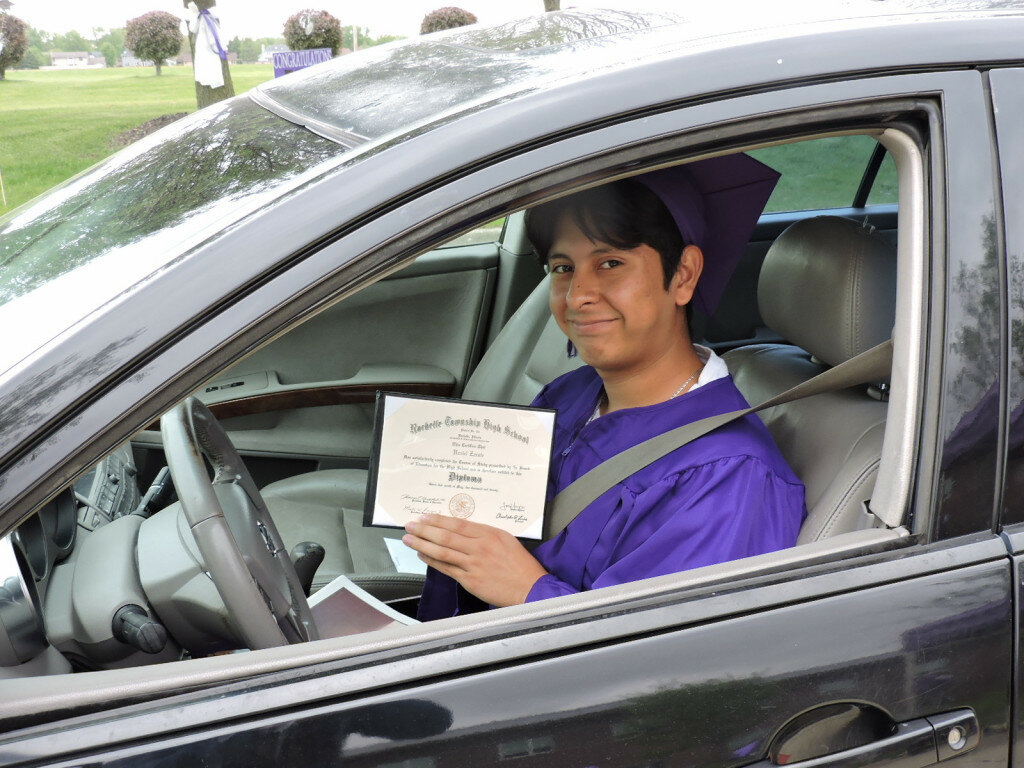 Uzziel Zarate picked up his diploma at RTHS Thursday dressed in his cap and gown.