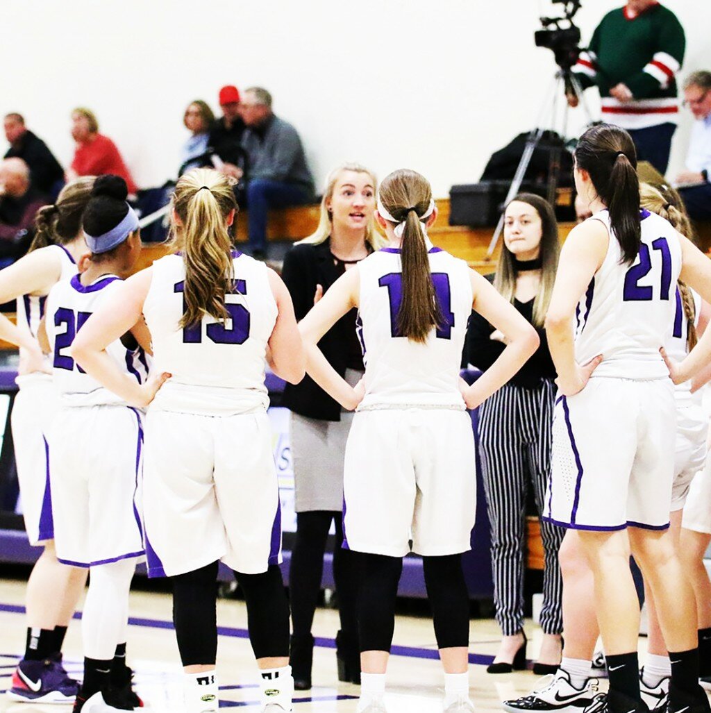Former Rochelle student-athlete Katie Roush speaks to her sophomore basketball players during a timeout. Since graduating RTHS, Roush has taken on coaching positions with the Lady Hub volleyball, girls basketball and girls track and field programs. (Photo by Marcy DeLille)
