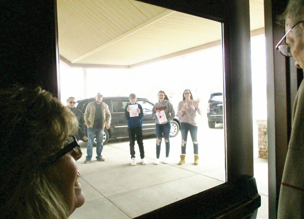 Since family members are not able to be inside with loved ones, Bill Zimmerman’s family recently wished him a happy birthday from outside (above).