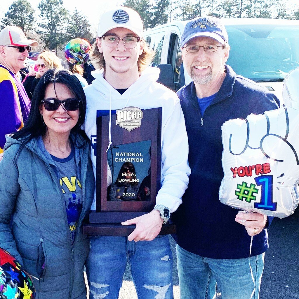 Former Rochelle bowling standout Brady Shank holds the NJCAA National Championship trophy during a rally at Rock Valley College over the weekend. Shank is pictured above with his mother Maria and father John. (Courtesy photo)