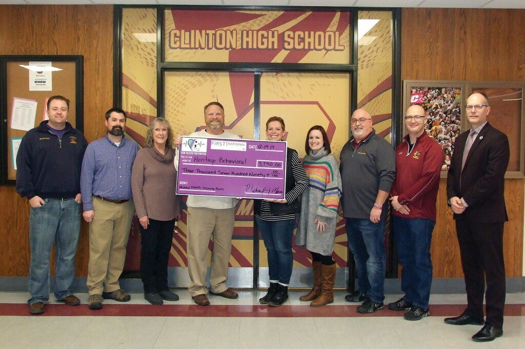 Gordon Woods / Journal — 
The Run for Life board recently presented a donation to help teachers and first responders receive training to recognize and help teens who might be contemplating suicide.  Left to right, board members Blake West, Cory Baxter, Marion Brisard, Run for Life coordinator Michael Moore, Katy Arnold, Jessica Smith, Clinton High School principal Jerry Wayne, assistant principal Robert Svencner, and superintendent of schools Curt Nettles.  The $3,790 donation came from the Run for Life event that took place on Nov. 2.