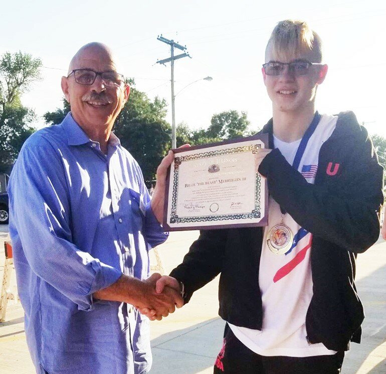 Submitted photos — 
Bilie “The Beast” Merreighn, 15, received a welcome home parade in Weldon, on Thursday, Aug. 8, after winning the gold medal at the world championship of the International Mixed Martial Arts Federation (IMMAF) in the 158-pound weight class.   Merreighn is a sophomore at DeLand-Weldon High School and was presented a certificate of honor from the State of Illinois presented by Rep. Dan Caulkins. 