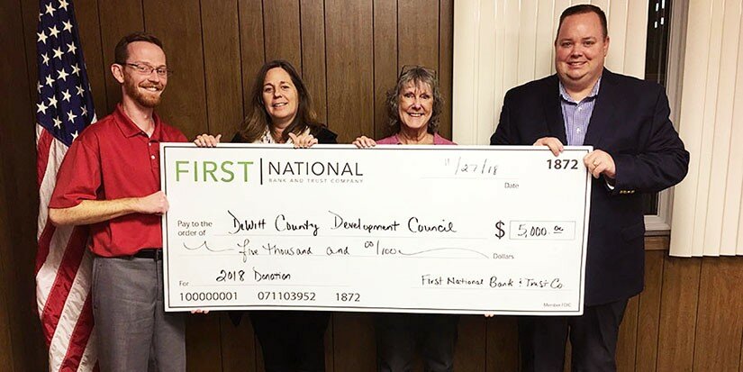 Courtesy of First National Bank & Trust 
David Torbert, President of DCDC, Elizabeth Foulks, Executive Director of DCDC, Marian Brisard, Executive Director of Clinton Area Chamber of Commerce, and Josh Shofner, President of First National Bank and Trust Company.