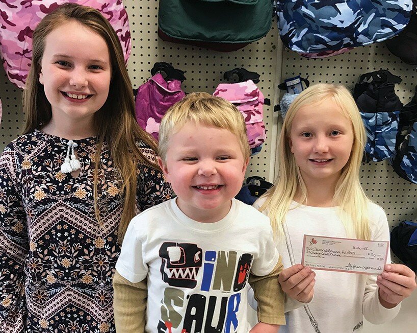 Susan Muñoz / Journal
Bella, 10, Jenna, 8, and Jace,2, Hoffman, of Hoffman Farms,Maroa, delivered on a promise they made earlier this year to donate $1 for every dozen ears of sweet corn they sold.  The sisters sold over 1,000 ears.  Second Chance for Pets, Clinton’s local nonprofit pet adoption agency, accepted the donation.