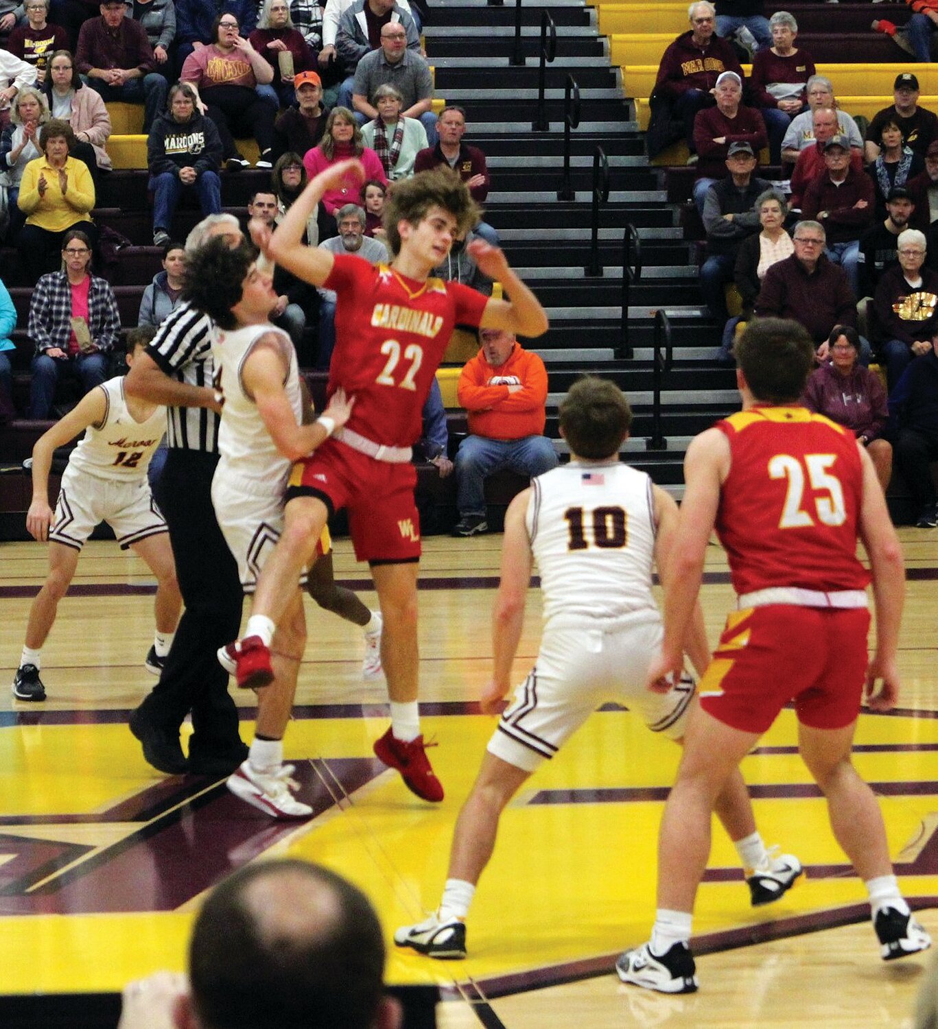 The jump ball goes to the Maroons who then turn it over to the opposition.