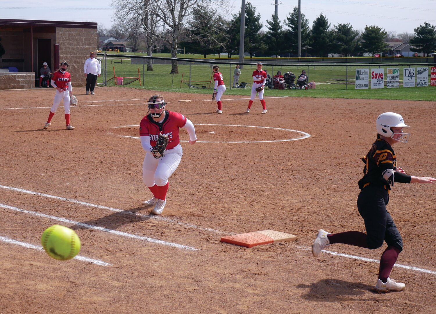 A loose ball made it possible for Clinton Lady Maroons varsity 15 player to cross 1st base in their game Saturday against the Heyworth Lady Hornets.  The rally wasn’t enough to put the Lady Maroons in the win column, Heyworth winning 6-4.