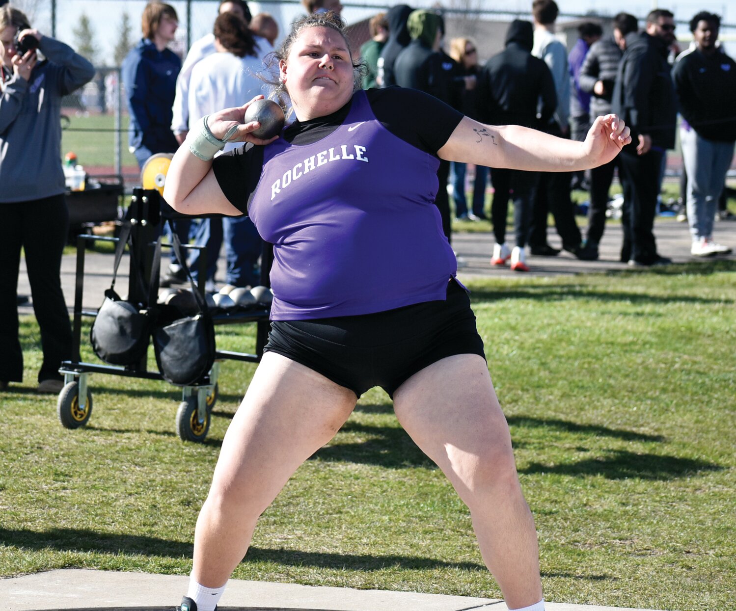Senior Erin Murphy launches her shot during the Rochelle Township High School track and field meet on Tuesday.