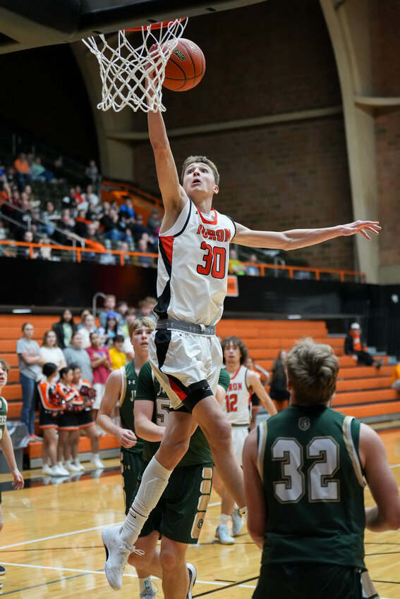 Huron's Blake Ellwein goes in for a basket during a game against Sioux Falls Jefferson on Jan. 20 at Huron Arena.