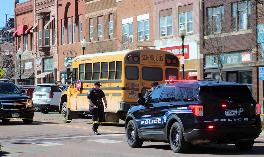 A Brookings School Bus sits parked on Main Street after a fatal collision around 10 a.m. Friday morning.