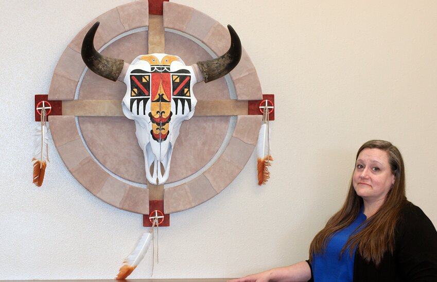 Archivist Michele Christian shows off a piece of Native American artwork received from former U.S. Senate Majority Leader Tom Daschle and now on display in the SDSU Archives and Special Collections office.
