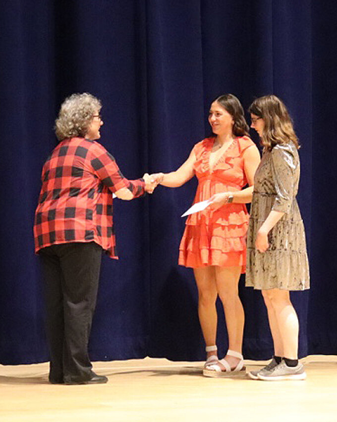 Shirley Holt presents Chloe Zens and Autumn Olsen with scholarships from Right to Life.