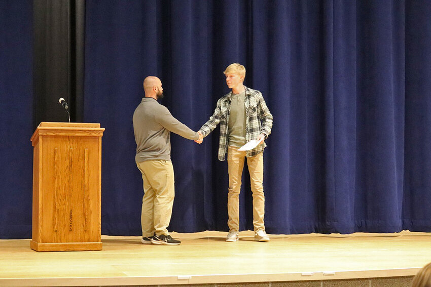 Tristan O’Daniel is awarded a Build Dakota Scholarship, presented by Redfield School Foundation Vice President Ted Williams.