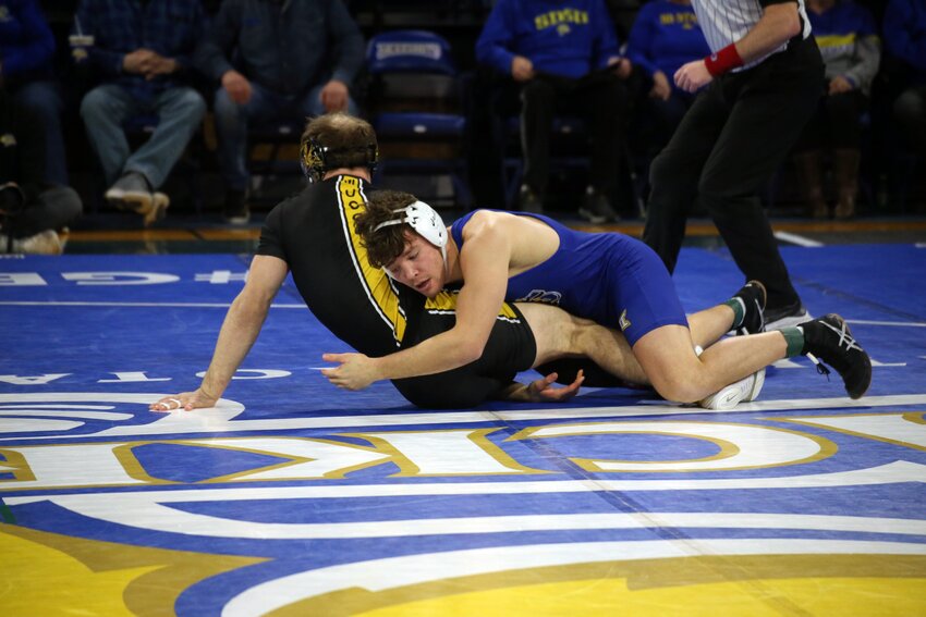 South Dakota State's Cade DeVos wrestles against Missouri's Peyton Mocco in the 174-pound weight class on Sunday afternoon during a dual. DeVos won the match with a 5-0 decision.