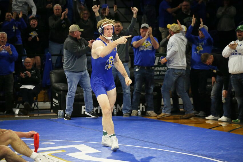 South Dakota State wrestler Tanner Sloan celebrates after winning by fall against Missouri's Rocky Elam during a Big 12 dual at Frost Arena on Sunday afternoon.