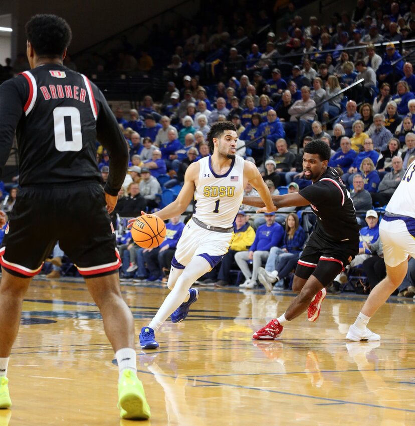 South Dakota State's Matt Mims dribbles with the ball during a 97-70 win over Denver on Thursday night at Frost Arena in Brookings. Mims had a career-high 21 points in the victory.