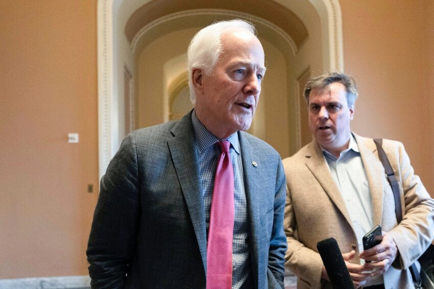 Sen. John Cornyn, R-Texas, speaks to reporters on Feb. 28 — shortly before Senate Minority Leader Mitch McConnell of Kentucky announced he will step down as Senate Republican leader in November — at the Capitol in Washington, D.C.
