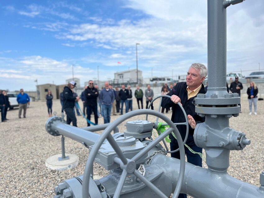 NorthWestern Energy CEO Brian Bird turns the valve at the company’s new renewable natural gas injection site on April 22, 2024, in Brookings.